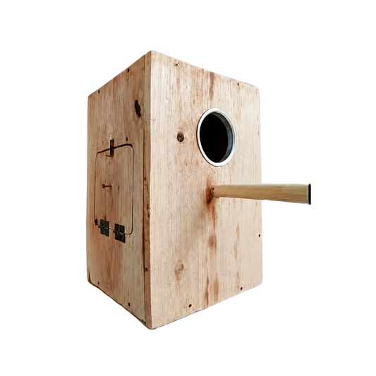 A wooden dog enrichment box with a circular entry hole and a horizontal wooden stick, shown on a white background with Petsmart branding.